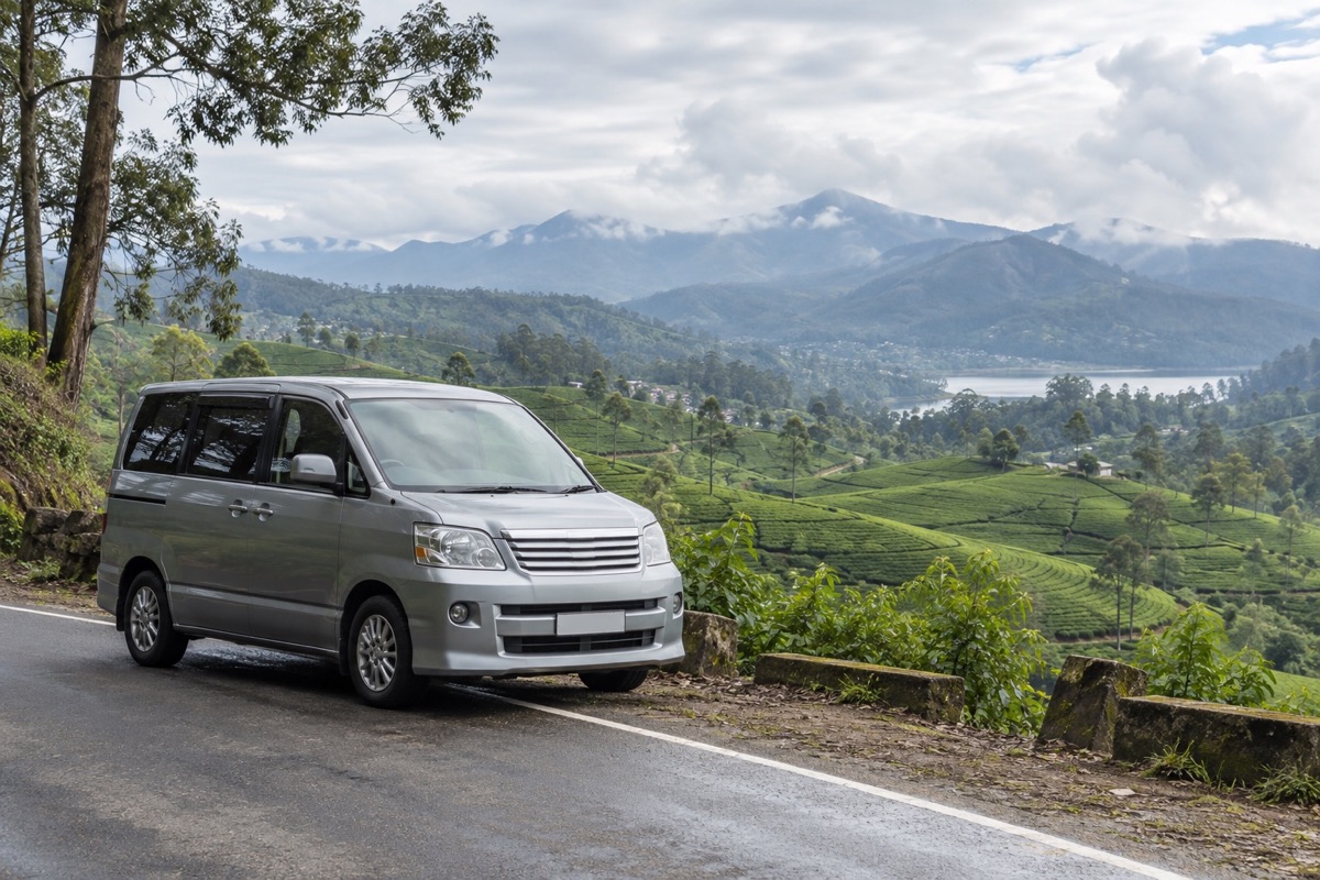 A passenger van at a viewpoint overlooking Sri Lanka’s tea-covered hill country